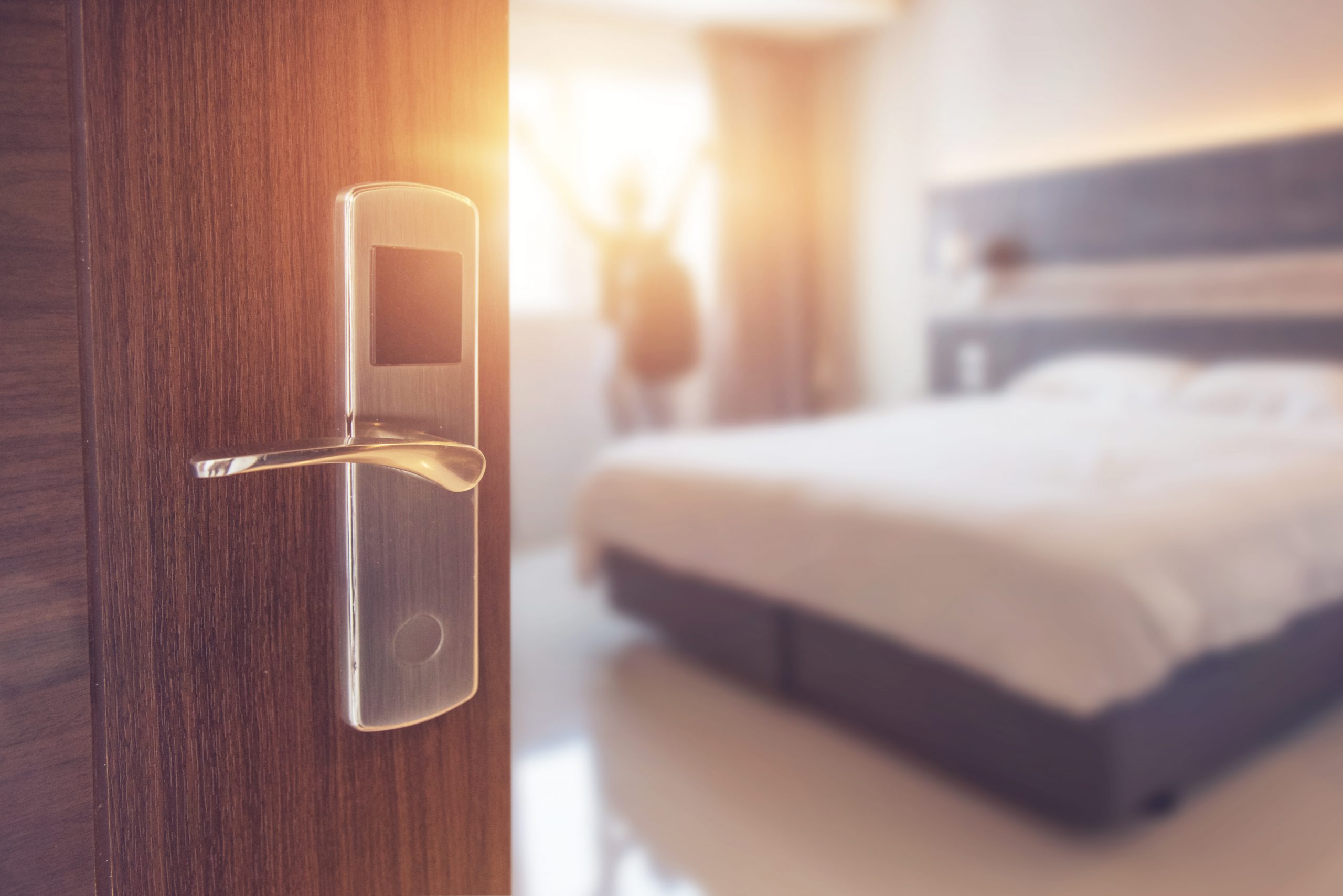 Opened door of hotel room in morning